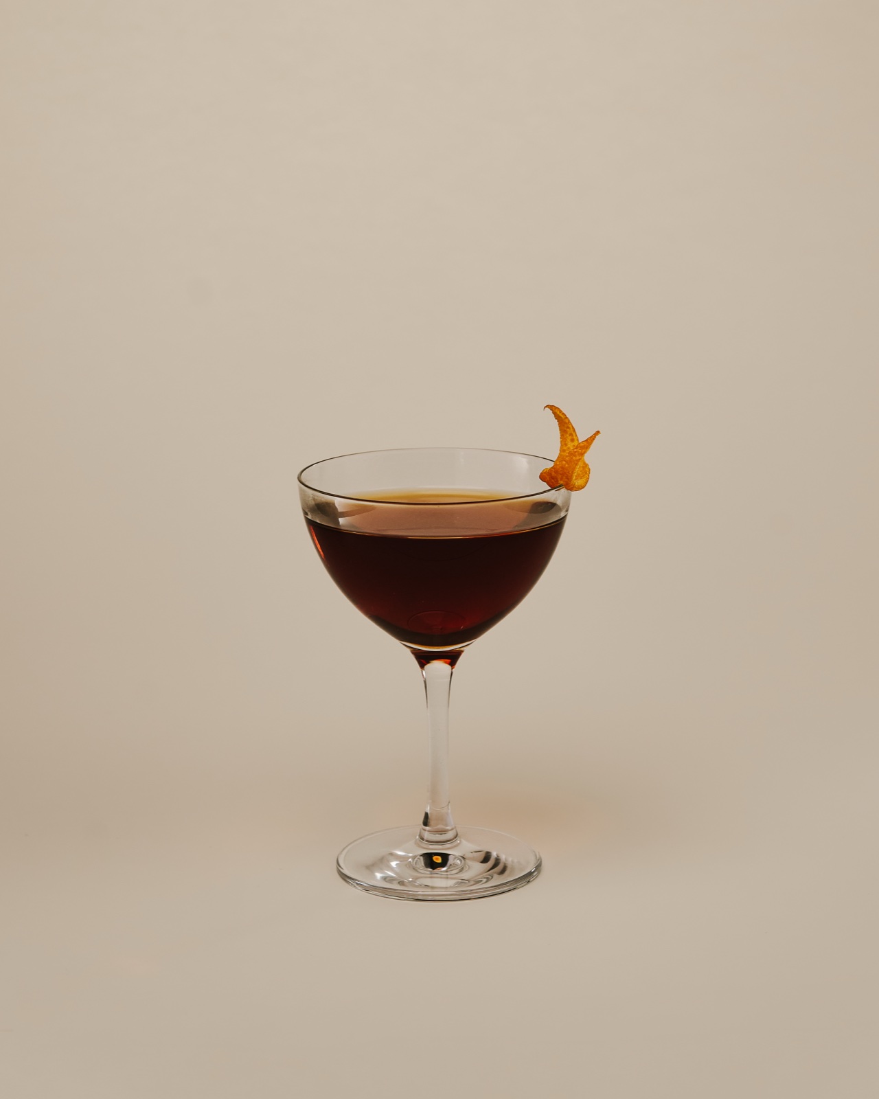 Manhattan served in a coupe with an orange twist