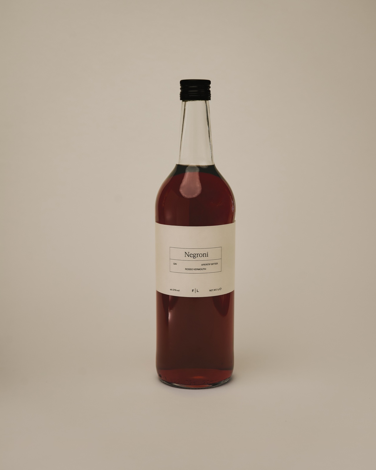 Deep red bottled Negroni